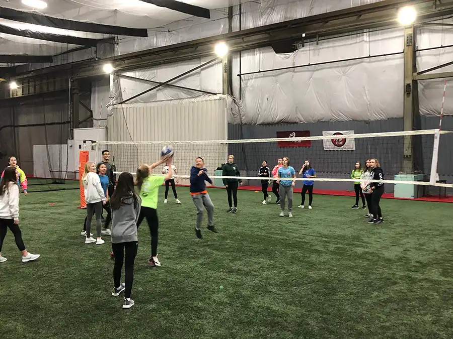 Indoor volleyball game in action